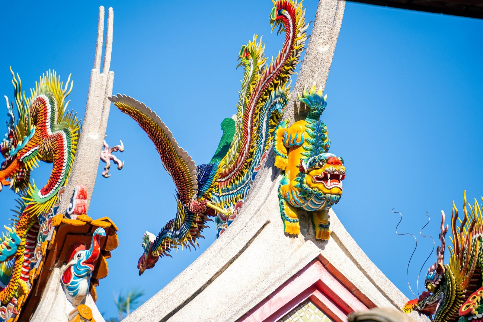 a dragon statue on top of a building