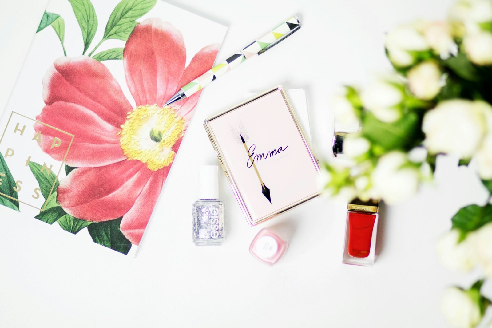 pink Emma box beside nail polish