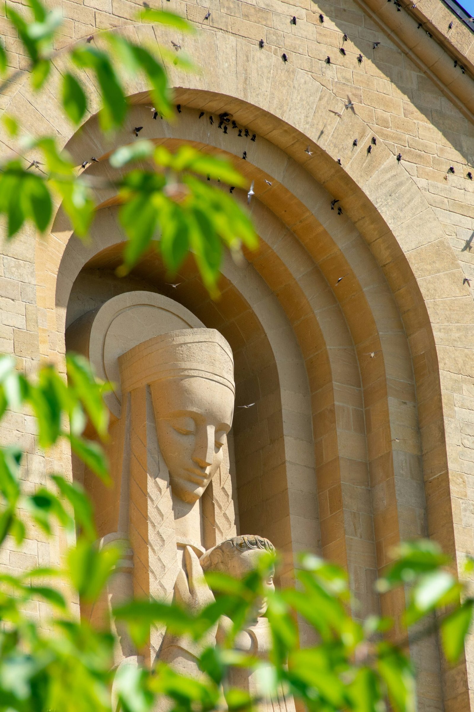 a stone arch with a face carved into it